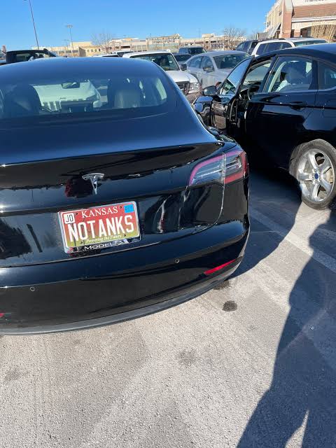 a vehicle license plate from Kansas. It says No tanks